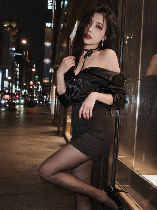 Black evening dress on a city street
