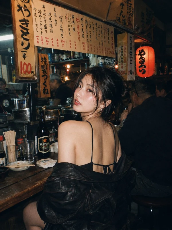 Evening portrait in a warmly lit restaurant